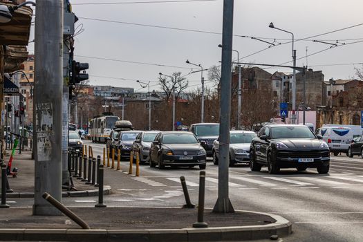Car traffic at rush hour in downtown area of the city. Car pollution, traffic jam in Bucharest, Romania, 2022