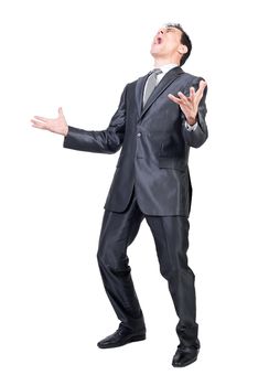 Full body of upset expressive young male manager with dark hair in formal suit and tie screaming loudly with closed eyes against white background