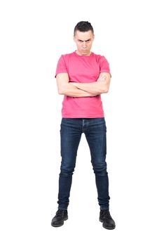 Full body grumpy male in casual clothes crossing arms and looking at camera with frown isolated on white background