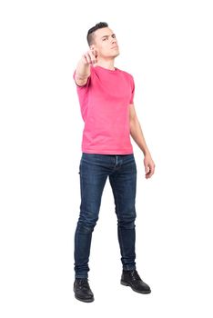 Full body of self assured male model in casual outfit pointing in front and choosing you on white background