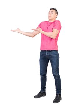 Full body of confused male model in casual outfit pointing aside and looking at camera with amazed face isolated on white background