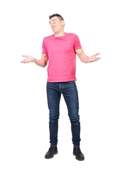 Self assured male in casual clothes shrugging shoulders with closed eyes while accepting praise against white background