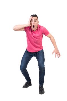 Full body of amazed male touching face and looking at camera with opened mouth isolated on white background in studio