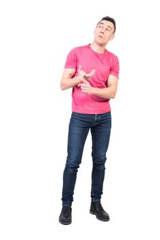 Full body of pensive male recalling numbers while counting on fingers in studio against white background