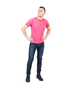 Full body of vigilant male guard looking into distance with serious face while standing with hands on waist on isolated white background