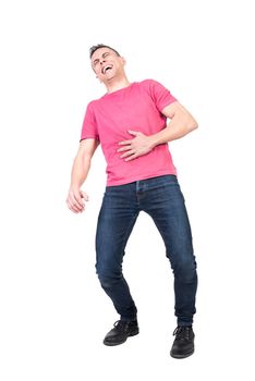 Full body of overjoyed male model laughing with opened mouth and closed eyes while holding hand on stomach against white background