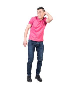 Full body of modest young male with hand behind head looking into distance isolated on white background in light studio