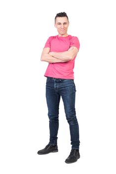 Full body of positive young male model in casual outfit looking at camera with crossed arms isolated on white background