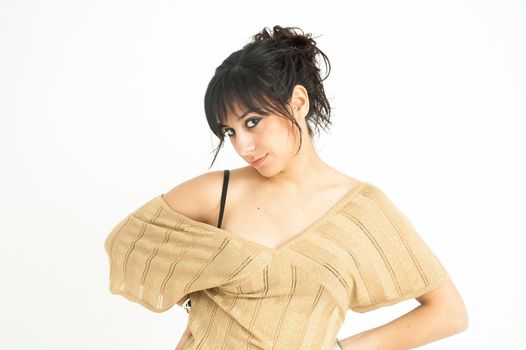 pretty girl staring at camera and smiling, with collected hair, on white background, medium shot