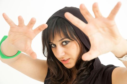Pretty brunette girl with palms up to enchant you, on white background, close up