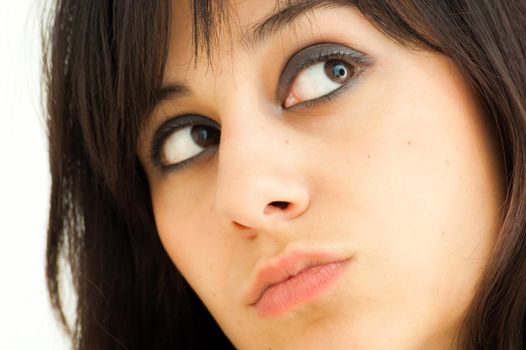 Pretty brunette girl looking aside, on white background, close up