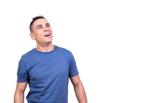 Studio portrait with white background of a man looking up with happy expression