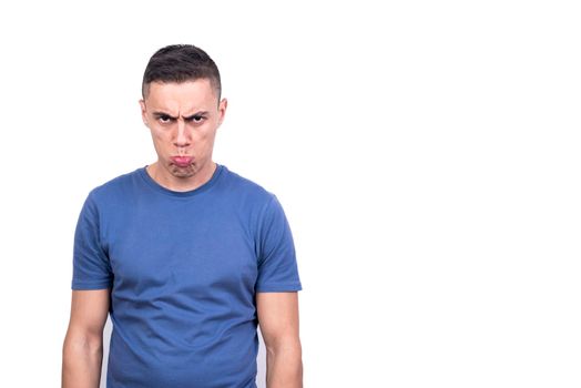 Studio photo of an adult man grimacing angrily while standing in a white wbckground
