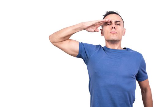 Studio portrait with white background of a man giving a military salute with a hand on his forehead