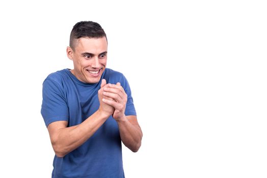 Studio portrait with white background of a man scrubbing his hands with a greedy expression