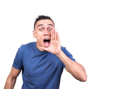 Studio photo with white background of a man with hand next to mouth screaming
