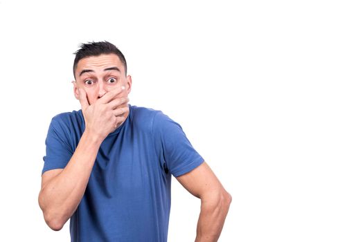 Studio photo with white background of a man covering his mouth with a surprised expression