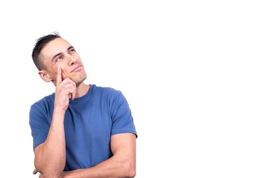 Studio photo with white background of a man with a finger on his cheek with a pensive look