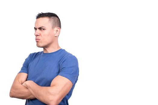 Studio photo with white background of a man turning aside with arms crossed and doubtful expression