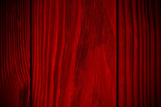 red textured wooden background with black. Vignette. Vintage bright background. Wood texture. High quality photo