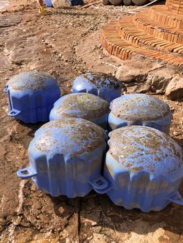 torn off parts of a plastic pontoon lying on the shore after a hurricane in Egypt. High quality photo