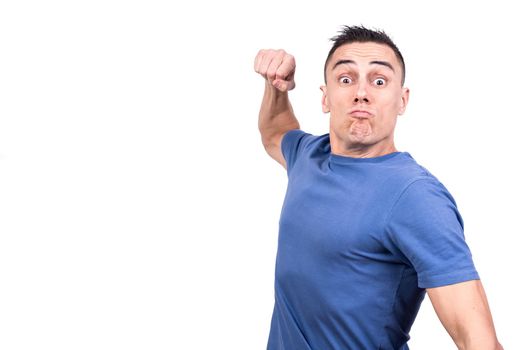 Studio photo with white background of a man threatening to strike with his fist
