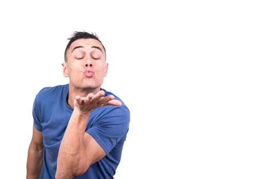 Studio photo with white background of a man blowing a kiss with the eyes closed