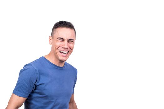 Studio portrait with white background of a man laughing