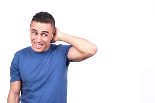 Studio photo with white background of a shy man disguising himself with the hand on the neck