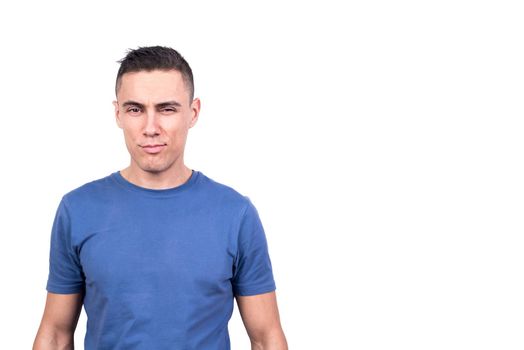 Studio photo with white background of a man looking at camera with cheeky smile