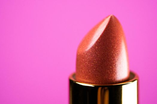 Lipstick on pink background. Showcase or advertisement for beauty brand, Concept of fashion, cosmetics with copy space. High quality