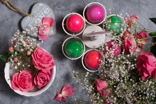 colorful easter eggs scattered on gray concrete background, top view, High quality photo