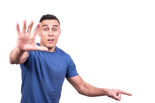 Studio portrait with white background of a male gesturing to stand up and pointing one side