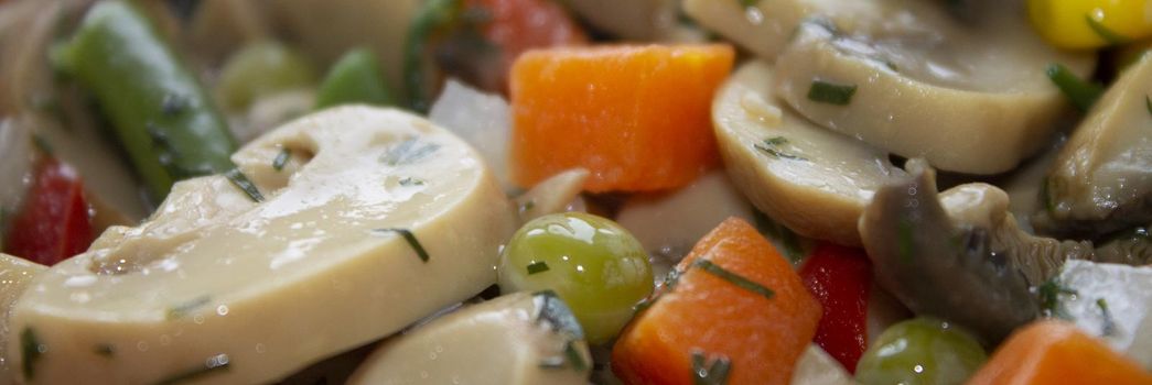 vegetable mixture with stewed mushrooms vegetarian dish with dill with a blurred background on top