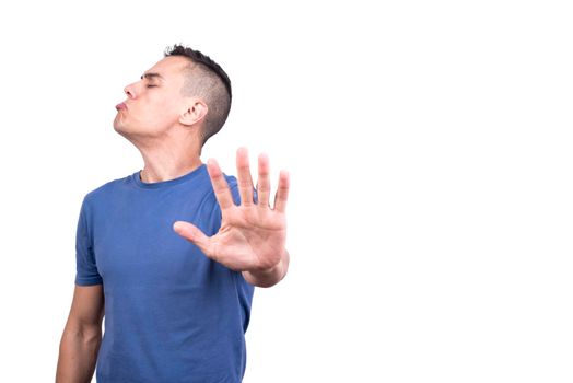 Studio portrait with white background of a man gesturing with the hand that doesn't want something