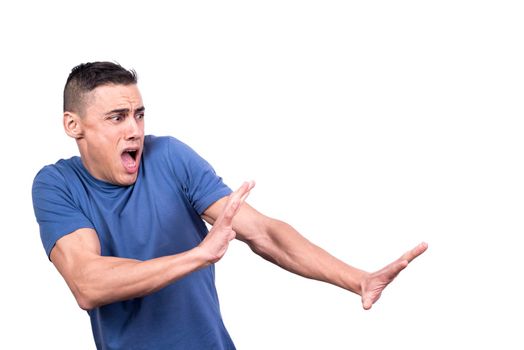 Studio portrait with white background of a man with open mouth while gesturing to move away