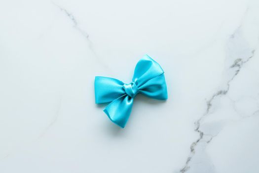 Holiday decor, feminine design and flatlay concept - Blue silk ribbon on marble, top view