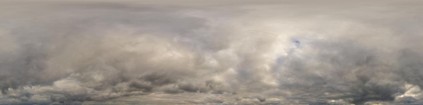 Sky panorama on overcast rainy day with low clouds in seamless spherical equirectangular format. Complete zenith for use in 3D graphics, game and for aerial drone 360 degree panorama as a sky dome.