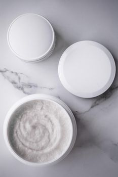 Skincare and body care, luxury spa and clean cosmetic concept. Health and beauty of your skin - Scrub and exfoliating cream products on a marble, flatlay