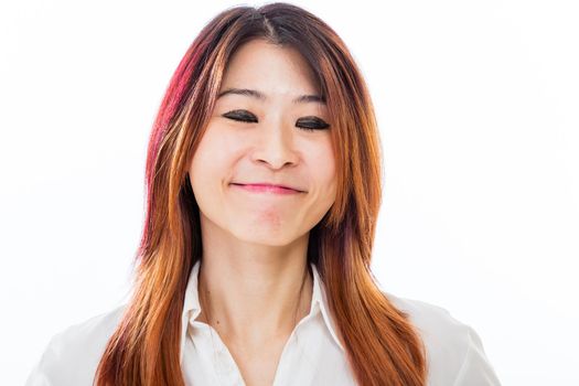 Asian Chinese businesswoman smiling with closed eyes