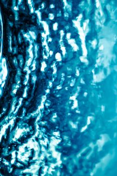 Abstract blue liquid surface as background - futuristic design and science concept. Deep blue waters