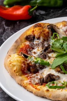 Delicious hot homemade pizza on the stone table background