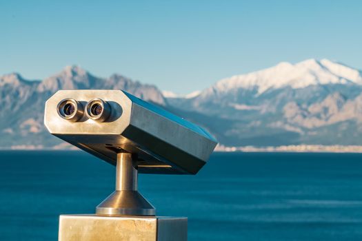 stationary observation binoculars at sunrise on a sunny winter day in Antalya Turkey