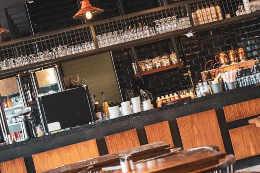 Counter full of equipment in empty coffee shop