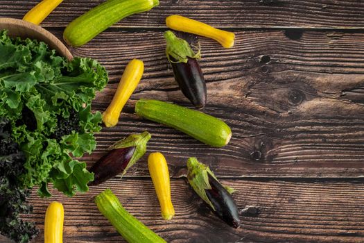 green leafy kale vegetable in bamboo bowl on wooden table background