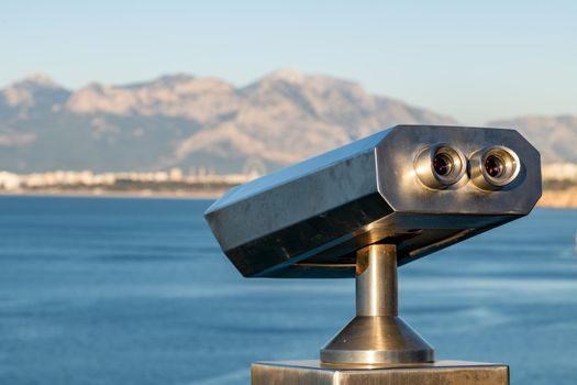 stationary observation binoculars at sunrise on a sunny winter day in Antalya Turkey