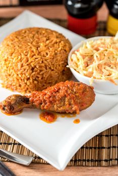 Regional African Food on white plate on wooden background