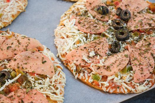 Frozen Italian pizza ready to be baked