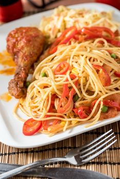 Regional African Food on white plate on wooden background