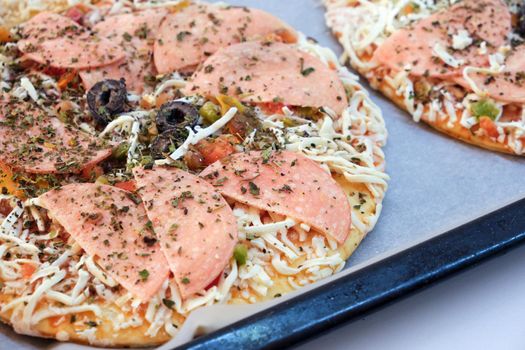 Frozen Italian pizza ready to be baked